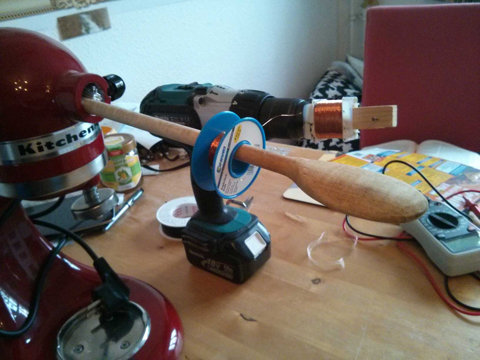 My improvised coil winding setup showing the coil mounted to the axle which itself was mounted to the drill machine.